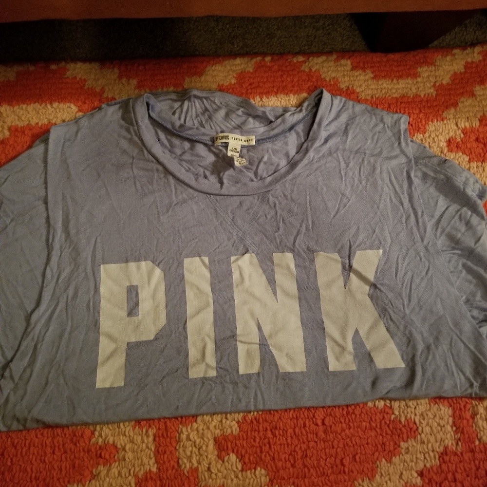 Large/light blue tee shirt.